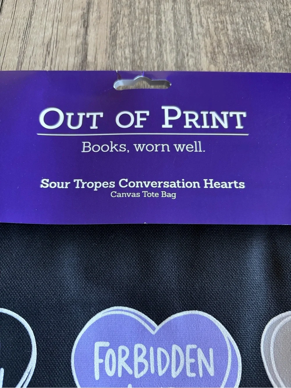 Out of Print Black Tote Bag with Purple and Gray Conversation Hearts